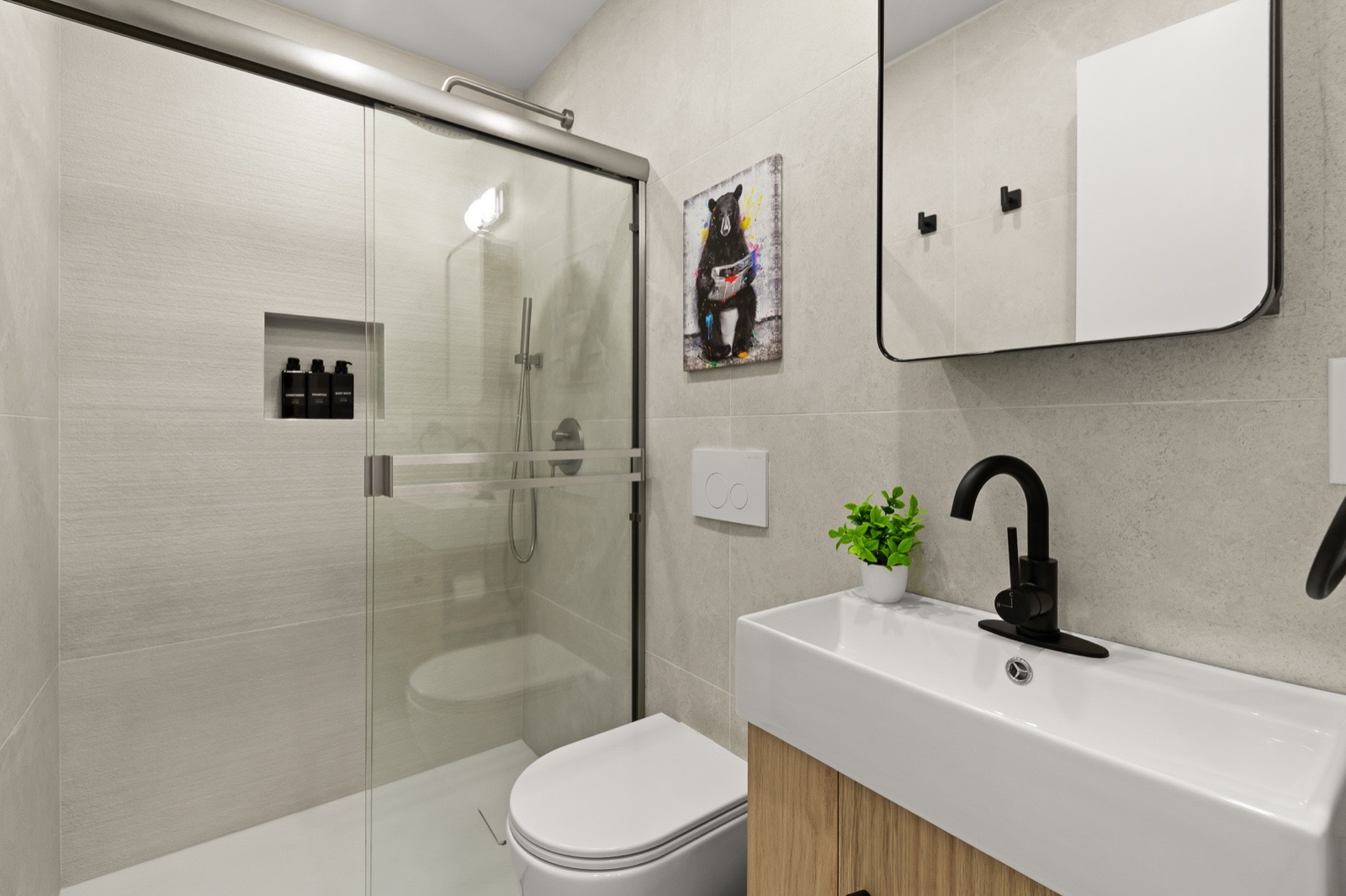 Private bathroom with glass walk-in shower